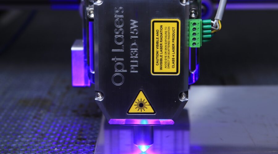 a close up of a machine with a purple light