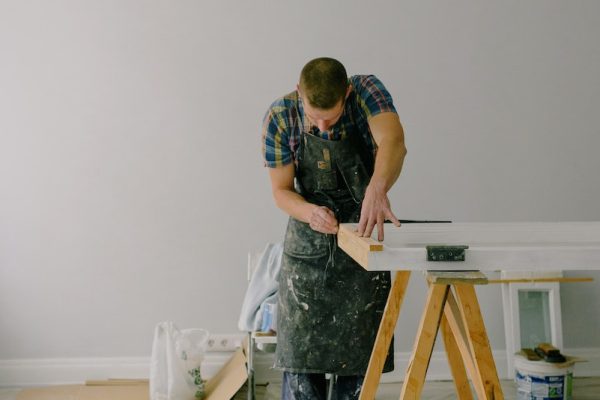 Concentrated man making repairs at home